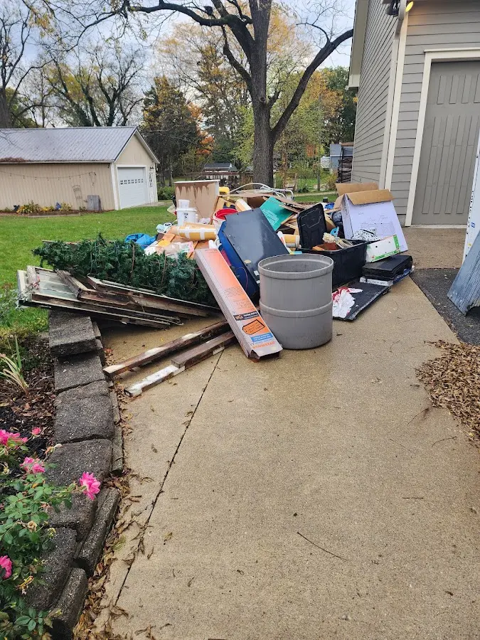 Dumpster being loaded with debris for Demolition Dumpster Rental in Lafayette